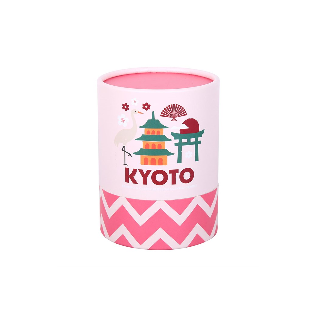 Pink cylindrical container candle packaging with 'Kyoto' design on a white background