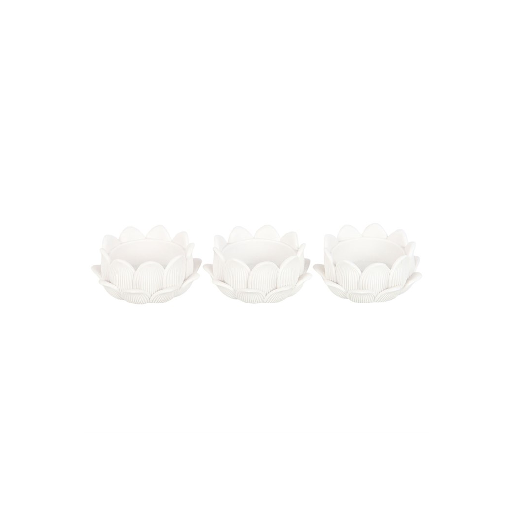 Three white ceramic tea light holders with floral patterns on a white background