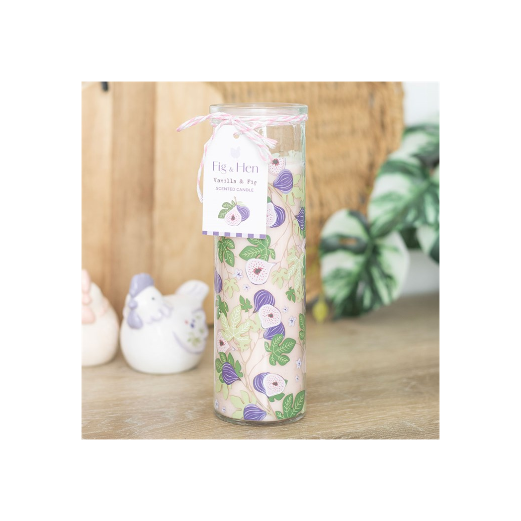 Decorative candle with floral design on a wooden surface