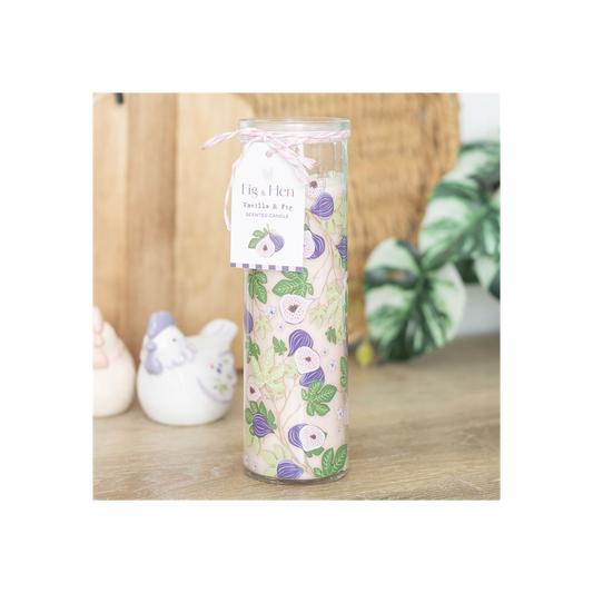 Decorative candle with floral design on a wooden surface