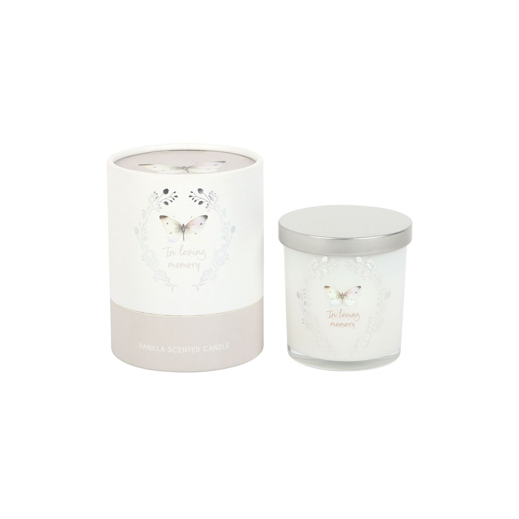 Two decorative candles with butterfly designs on a white background