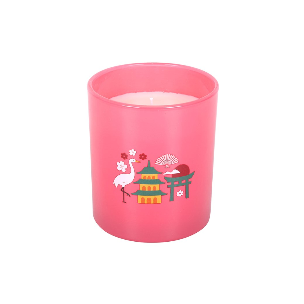 Pink candle with decorative design on a white background