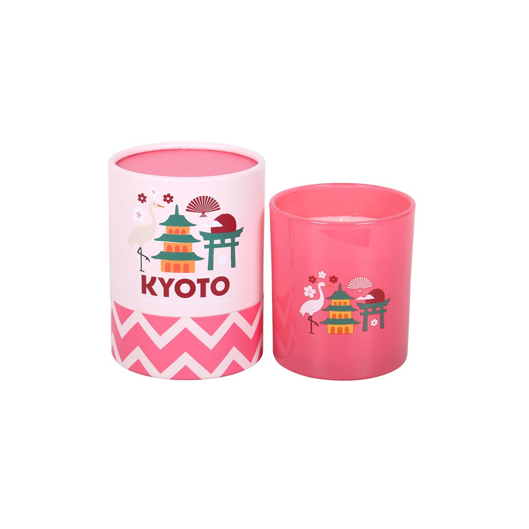Pink cylindrical container candle with 'Kyoto' text and traditional Japanese designs on a white background